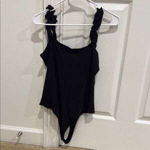 Black bodysuit with ruffled straps